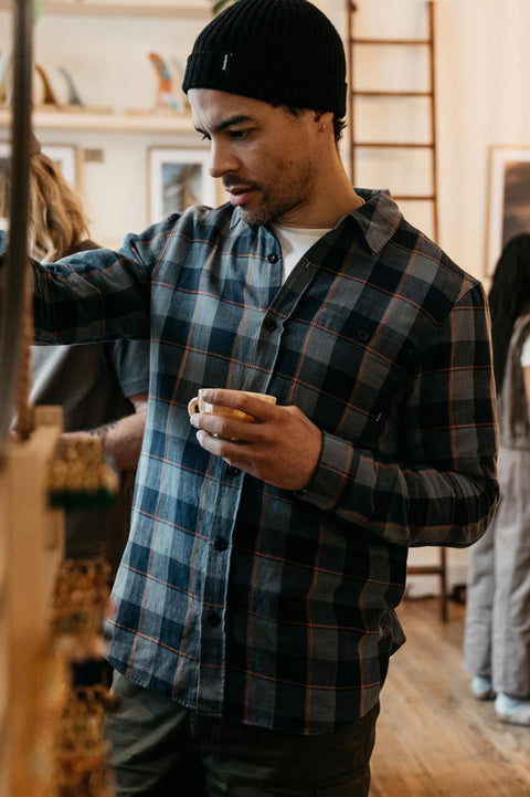 Finisterre Cardew Check Shirt - Navy - Front in a coffee shop