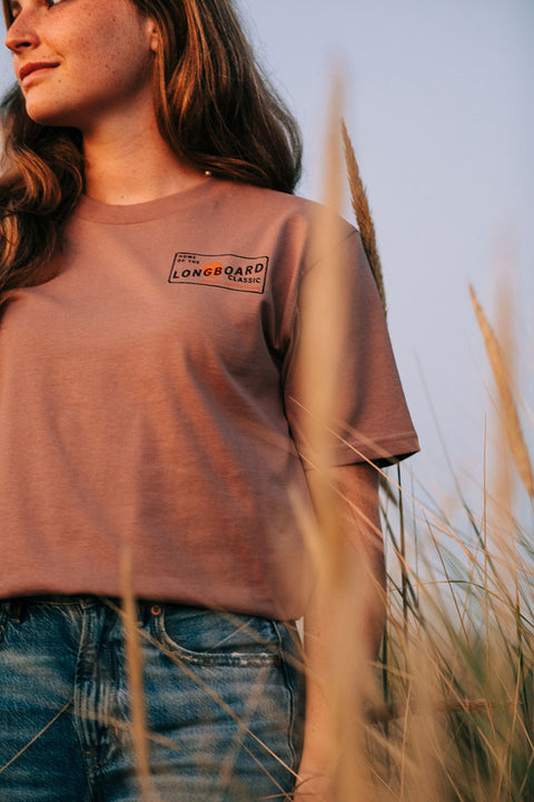 Moment The Classic T-Shirt - Hazy Pink - Front Female model in beach grass