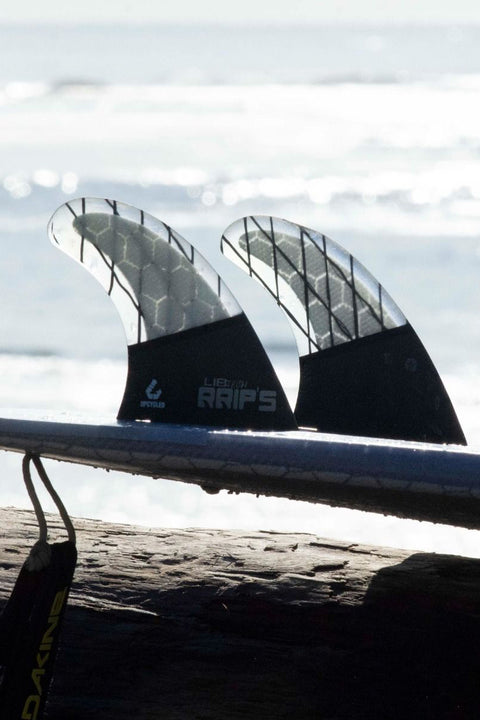 Lib Tech Tri Medium Fin Set - Black / Clear - On a board.