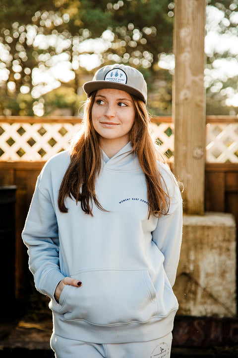 A model wearing the Moment Lady Glider Hoodie looking left.