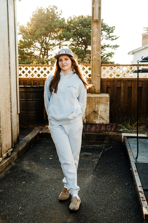 A model wearing the Moment Women's Lt. Dan Sweatpants staring at the camera.