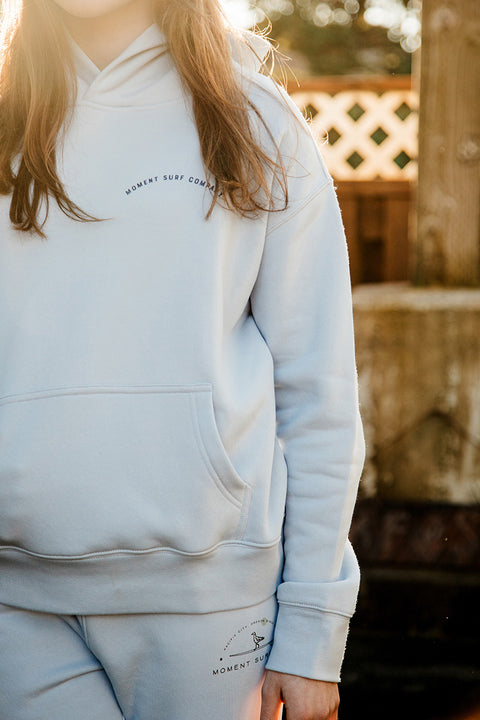 A closeup of the front of the Moment Lady Glider Hoodie.