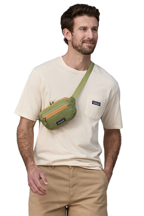 Patagonia Ultralight Black Hole Mini Hip Pack - Buckhorn Green- Slung on model